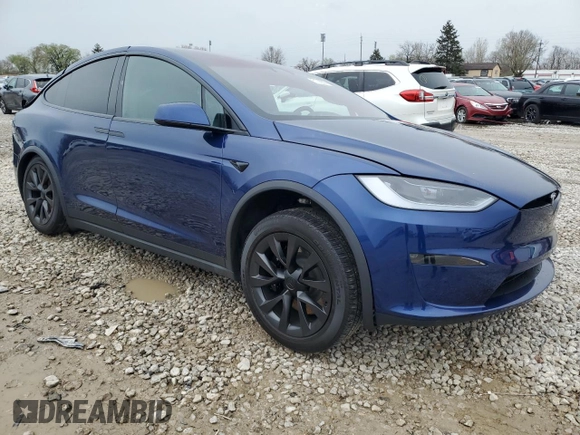 2023 Tesla Model X with VIN 7SAXCDE51PF415778, listed as a Copart auction lot 51792205 with Not Provided miles and Salvage Title. Bid and sale history available at DreamBid. Image 4.