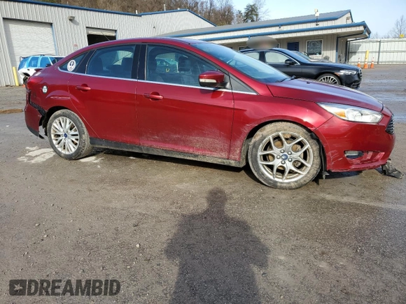 2015 Ford Focus Titanium with VIN 1FADP3J22FL239884, listed as a Copart auction lot 47628525 with 181,624 mi miles and Salvage Title. Bid and sale history available at carsss.com. Image 4.