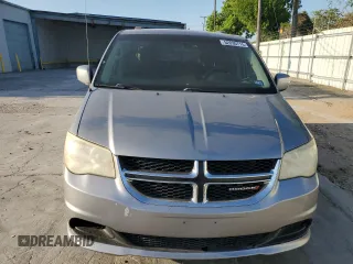 2014 Dodge Grand Caravan SXT with VIN 2C4RDGCG1ER121033, listed as a Copart auction lot 52030715 with 105,451 mi miles and Salvage Title. Bid and sale history available at DreamBid. Image 5.