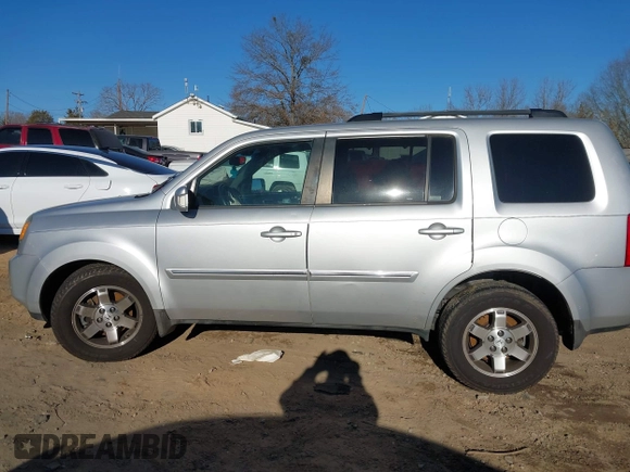 2009 Honda Pilot Touring with VIN 5FNYF48979B008851, listed as a IAAI auction lot 41252736 with 183,292 mi miles and . Bid and sale history available at carsss.com. Image 14.