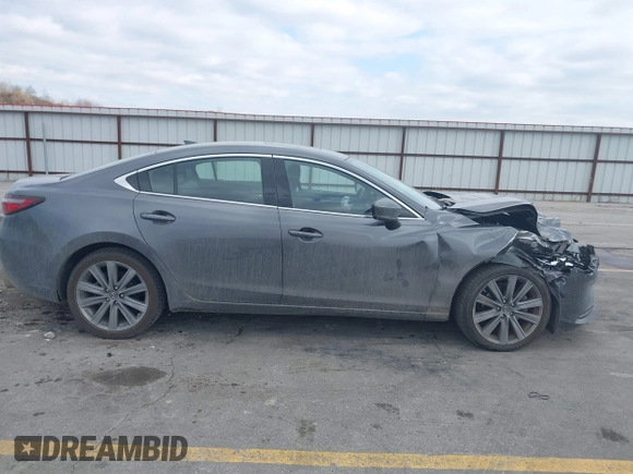 2020 Mazda 6 Grand Touring with VIN JM1GL1TY6L1525169, listed as a IAAI auction lot 41683512 with 73,313 mi miles and . Bid and sale history available at DreamBid. Image 13.
