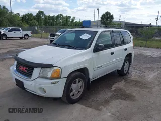 2003 GMC Envoy SLT with VIN 1GKDS13S732379218, listed as a IAAI auction lot 42164368 with Not Provided miles. Bid and sale history available at carsss.com. Image 2.