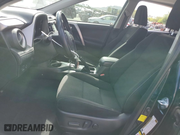 2018 Toyota RAV4 XLE with VIN JTMWFREV7JD130465, listed as a Copart auction lot 63314795 with 97,334 mi miles and Salvage title. Bid and sale history available at DreamBid. Image 7.
