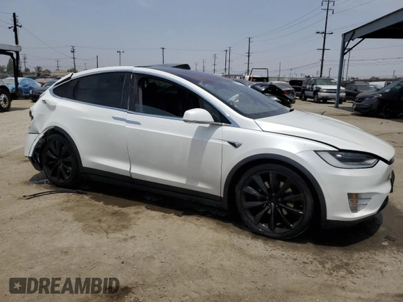 2017 Tesla Model X 90D with VIN 5YJXCAE26HF079421, listed as a Copart auction lot 47889005 with 88,281 mi miles and Salvage Title. Bid and sale history available at DreamBid. Image 4.