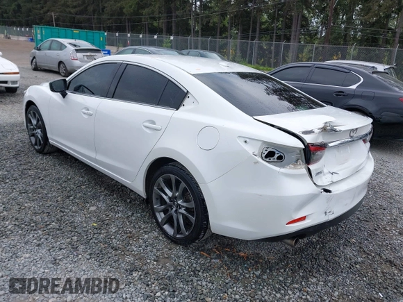 2017 Mazda 6 Grand Touring with VIN JM1GL1X51H1142473, listed as a IAAI auction lot 42234809 with 101,633 mi miles and . Bid and sale history available at DreamBid. Image 3.