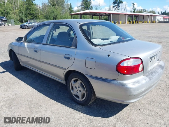 2001 Kia Sephia z VIN KNAFB121515092630, wystawiony jako IAAI lot #42361635 z przebiegiem 183 434 mil mil oraz . Historia ofert i sprzedaży dostępna na DreamBid. Obrazek 3.