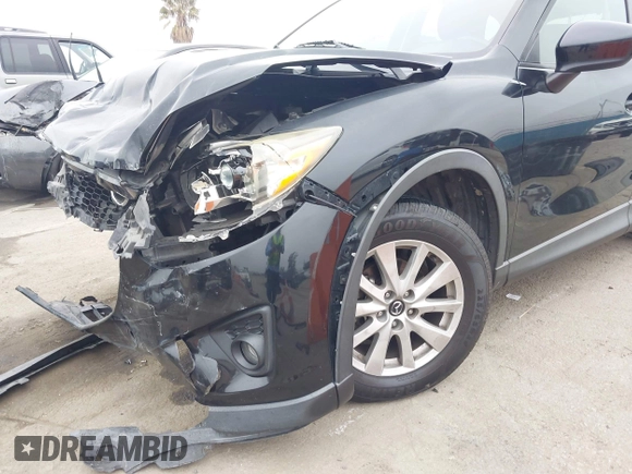 2014 Mazda CX-5 Touring z VIN JM3KE2CY3E0355332, wystawiony jako IAAI lot #42096306 z przebiegiem 108 198 mil mil oraz . Historia ofert i sprzedaży dostępna na DreamBid. Obrazek 16.