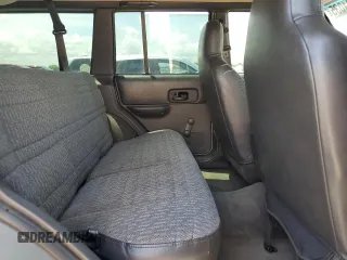 2000 Jeep Cherokee SE with VIN 1J4FF28SXYL140930, listed as a Copart auction lot 59191035 with 248,598 mi miles and Salvage title. Bid and sale history available at DreamBid. Image 11.