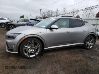 2023 Genesis GV60 Performance z VIN KMUKEDTB8PU012122, wystawiony jako Copart lot #50950384 z przebiegiem 7306 mil mil oraz . Historia ofert i sprzedaży dostępna na DreamBid. Obrazek 1.