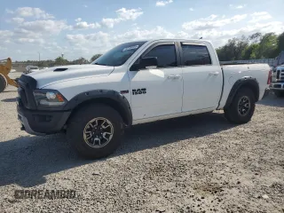 2016 Ram 1500 Rebel z VIN 1C6RR7YT7GS255707, wystawiony jako Copart lot #53700095 z przebiegiem 103 989 mil mil oraz Szkoda całkowita • Salvage title. Historia ofert i sprzedaży dostępna na DreamBid. Obrazek 1.
