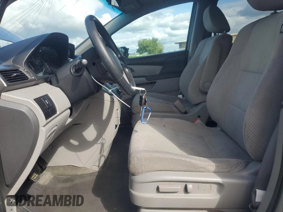 2015 Honda Odyssey LX with VIN 5FNRL5H27FB018491, listed as a Copart auction lot 54888445 with 129,488 mi miles and Salvage Title. Bid and sale history available at DreamBid. Image 7.
