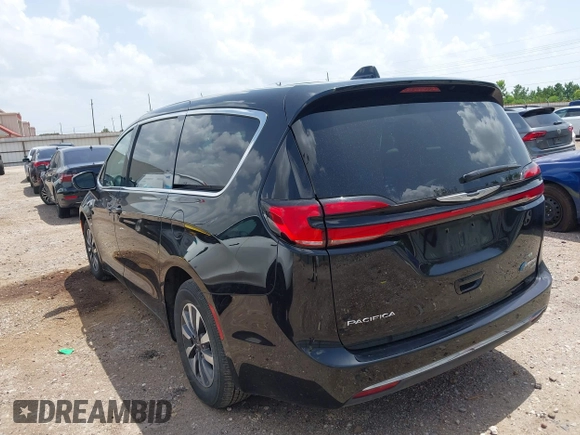 2023 Chrysler Pacifica Hybrid Touring L with VIN 2C4RC1L70PR622000, listed as a IAAI auction lot 42711826 with 65,109 mi miles and . Bid and sale history available at DreamBid. Image 3.