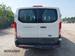 2015 Ford Transit Cargo z VIN 1FTNE1ZM4FKB15801, wystawiony jako IAAI lot #42674219 z przebiegiem 228 634 mil mil oraz . Historia ofert i sprzedaży dostępna na DreamBid. Obrazek 16.