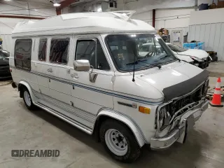 1990 GMC Vandura z VIN 1GDEG25K8L7521773, wystawiony jako Copart lot #84875104 z przebiegiem 171 457 mil mil oraz Tytuł czysty. Historia ofert i sprzedaży dostępna na DreamBid. Obrazek 4.