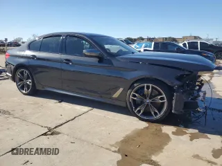 2020 BMW 5 Series M550i xDrive with VIN WBAJS7C07LCD97275, listed as a Copart auction lot 85764434 with Not provided miles and Clean title. Bid and sale history available at DreamBid. Image 4.