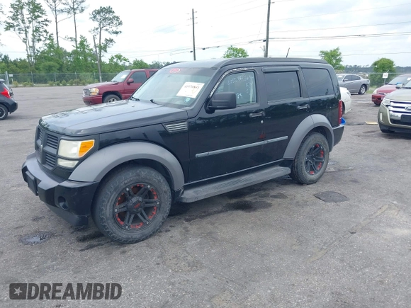 2007 Dodge Nitro SXT with VIN 1D8GT28K17W605984, listed as a IAAI auction lot 41970841 with 118,700 mi miles. Bid and sale history available at carsss.com. Image 2.