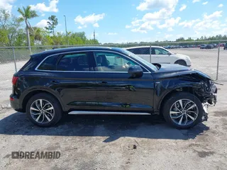 2023 Audi Q5 S line Premium Plus z VIN WA1EAAFY6P2168594, wystawiony jako IAAI lot #41863196 z przebiegiem 16 310 mil mil oraz . Historia ofert i sprzedaży dostępna na DreamBid. Obrazek 13.