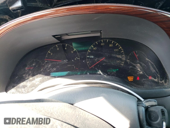 2004 Cadillac DeVille DTS z VIN 1G6KF57994U203706, wystawiony jako Copart lot #76278324 z przebiegiem 203 709 mil mil oraz Szkoda całkowita • Salvage title. Historia ofert i sprzedaży dostępna na DreamBid. Obrazek 9.
