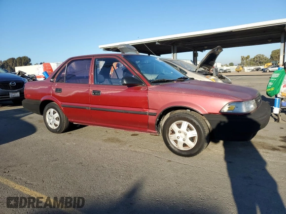 1989 Toyota Corolla with VIN JT2AE92E4K0112945, listed as a Copart auction lot 83382604 with 209,462 mi miles and Salvage title. Bid and sale history available at DreamBid. Image 4.