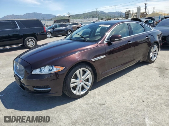 2014 Jaguar XJ with VIN SAJWA1CZ3E8V69877, listed as a Copart auction lot 51520405 with 57,567 mi miles and Clean Title. Bid and sale history available at DreamBid. Image 1.