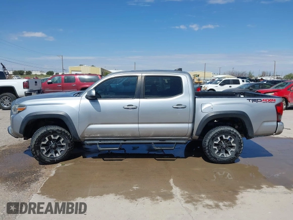2018 Toyota Tacoma SR with VIN 3TMCZ5AN3JM170037, listed as a IAAI auction lot 42565385 with 157,450 mi miles and . Bid and sale history available at DreamBid. Image 14.