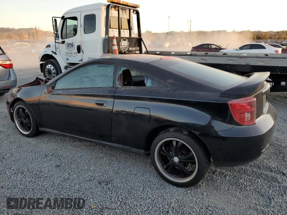 2004 Toyota Celica GT with VIN JTDDR32T040168744, listed as a Copart auction lot 85504754 with 210,919 mi miles and Clean Title. Bid and sale history available at DreamBid. Image 2.