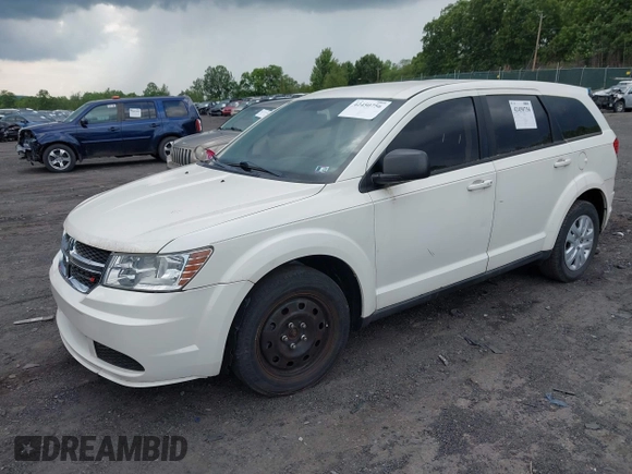 2013 Dodge Journey SE with VIN 3C4PDCAB7DT695493, listed as a IAAI auction lot 42450756 with 153,064 mi miles and . Bid and sale history available at DreamBid. Image 2.