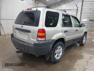 2005 Ford Escape XLT with VIN 1FMYU03115KA29039, listed as a IAAI auction lot 42159988 with 240,047 mi miles and . Bid and sale history available at DreamBid. Image 4.