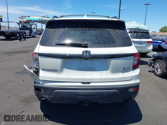 2019 Honda Passport Elite z VIN 5FNYF8H05KB009575, wystawiony jako IAAI lot #42804678 z przebiegiem 70 468 mil mil oraz . Historia ofert i sprzedaży dostępna na DreamBid. Obrazek 17.