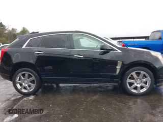 2011 Cadillac SRX Performance Collection with VIN 3GYFNBEYXBS597881, listed as a IAAI auction lot 41016643 with 164,781 mi miles and . Bid and sale history available at carsss.com. Image 13.