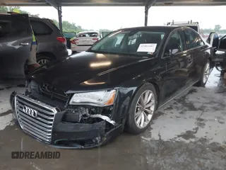 2012 Audi A8 with VIN WAUAVAFD9CN006499, listed as a IAAI auction lot 42461402 with 57,232 mi miles and . Bid and sale history available at DreamBid. Image 2.