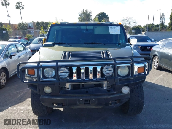 2003 Hummer H2 z VIN 5GRGN23UX3H124727, wystawiony jako IAAI lot #41697787 z przebiegiem 241 554 mil mil oraz . Historia ofert i sprzedaży dostępna na DreamBid. Obrazek 12.