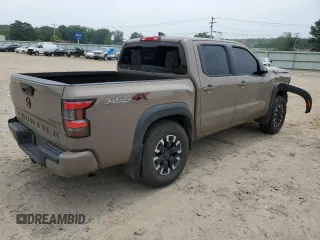 2023 Nissan Frontier Pro-4X with VIN 1N6ED1EK0PN617872, listed as a Copart auction lot 57125435 with 97,981 mi miles and Salvage title. Bid and sale history available at DreamBid. Image 3.