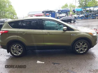 2013 Ford Escape SEL с VIN 1FMCU9HX2DUB52251, выставлен на аукционе IAAI как лот 42253659 с пробегом Не указан миль и . История ставок и продаж доступна на DreamBid. Изображение 13.