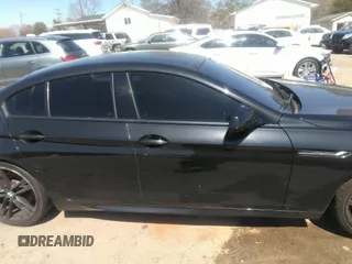 2014 BMW 6 Series 640i z VIN WBA6A0C57EDZ04682, wystawiony jako IAAI lot #41891362 z przebiegiem 140 478 mil mil oraz . Historia ofert i sprzedaży dostępna na DreamBid. Obrazek 13.