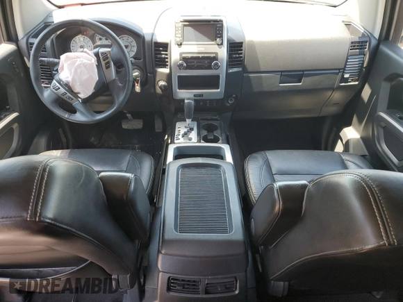 2015 Nissan Titan Pro-4X with VIN 1N6BA0EC5FN506358, listed as a Copart auction lot 56671205 with 153,712 mi miles and Salvage title. Bid and sale history available at DreamBid. Image 8.