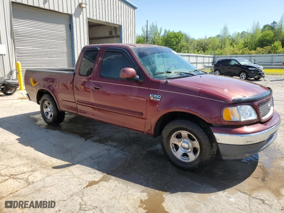 1999 Ford F-150 Work Series with VIN 1FTRX17WXXNC12811, listed as a Copart auction lot 52537395 with 0 mi miles and Salvage Title. Bid and sale history available at carsss.com. Image 4.