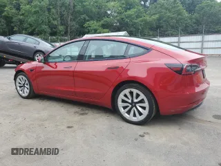2023 Tesla Model 3 with VIN 5YJ3E1EA6PF437390, listed as a Copart auction lot 62825135 with 115,121 mi miles and Clean title. Bid and sale history available at DreamBid. Image 2.