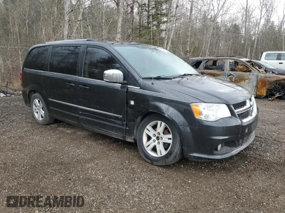 2011 Dodge Grand Caravan Crew with VIN 2D4RN5DG2BR762738, listed as a Copart auction lot 49528955 with 203,748 mi miles and Clean Title. Bid and sale history available at DreamBid. Image 4.