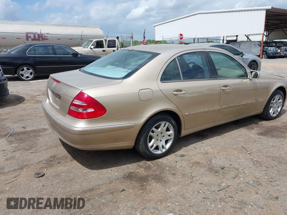 2003 Mercedes-Benz E-Class 3.2L with VIN WDBUF65J23A243178, listed as a IAAI auction lot 41974660 with 134,459 mi miles. Bid and sale history available at carsss.com. Image 4.