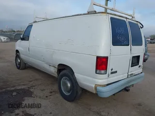 1999 Ford Econoline Cargo Commercial with VIN 1FTNE24L3XHB84868, listed as a IAAI auction lot 41151145 with 450,651 mi miles and . Bid and sale history available at carsss.com. Image 3.