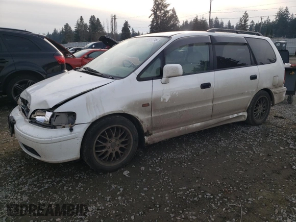 1998 Honda Odyssey with VIN RA31038664, listed as a Copart auction lot 43051785 with 106,084 mi miles and Salvage title. Bid and sale history available at DreamBid. Image 1.