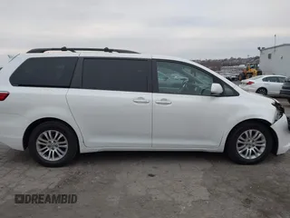 2015 Toyota Sienna XLE with VIN 5TDYK3DC9FS595827, listed as a IAAI auction lot 41014820 with 119,143 mi miles. Bid and sale history available at carsss.com. Image 13.