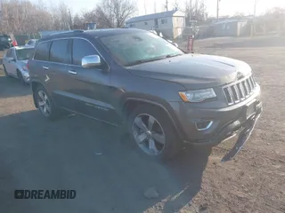 2015 Jeep Grand Cherokee Overland with VIN 1C4RJFCT3FC725239, listed as a IAAI auction lot 41779555 with 100,837 mi miles. Bid and sale history available at carsss.com. Image 1.