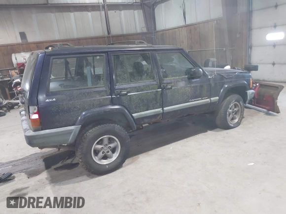 1999 Jeep Cherokee Sport with VIN 1J4FF68S2XL602709, listed as a IAAI auction lot 41177232 with Not Provided miles. Bid and sale history available at carsss.com. Image 4.