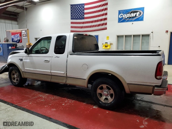 1999 Ford F-150 Work Series with VIN 1FTRX17W7XNC02138, listed as a Copart auction lot 73436294 with 0 mi miles and Salvage Title. Bid and sale history available at carsss.com. Image 2.