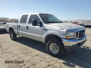 2002 Ford F-250 XL with VIN 1FTNW21L92ED10310, listed as a Copart auction lot 59132935 with 217,885 mi miles and Salvage title. Bid and sale history available at DreamBid. Image 4.