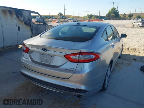 2014 Ford Fusion SE Hybrid with VIN 3FA6P0LU2ER319451, listed as a IAAI auction lot 41998180 with 170,191 mi miles. Bid and sale history available at carsss.com. Image 4.