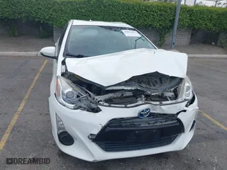2015 Toyota Prius c One with VIN JTDKDTB3XF1097538, listed as a IAAI auction lot 42031057 with 100,847 mi miles. Bid and sale history available at carsss.com. Image 12.