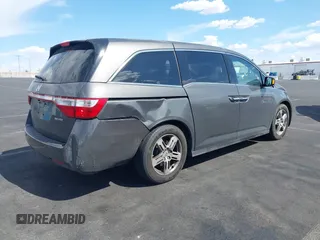 2013 Honda Odyssey Touring with VIN 5FNRL5H95DB045666, listed as a IAAI auction lot 42117219 with 50,715 mi miles and . Bid and sale history available at carsss.com. Image 6.